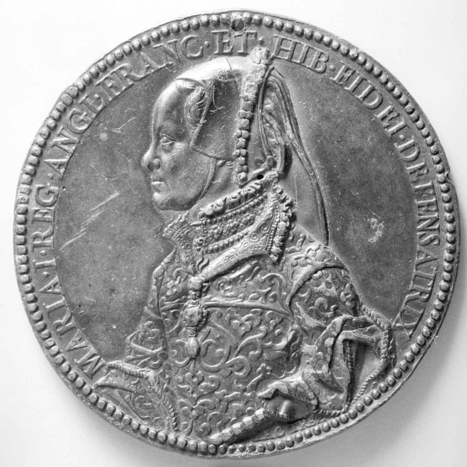 Medal with a portrait of a woman on a white background